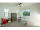 Bright bedroom featuring three windows, carpeted floors and a ceiling fan at 2973 E Austin Dr, Gilbert, AZ 85296