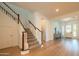 Grand two-story foyer with wood floors, elegant staircase, and stylish entry decor at 2973 E Austin Dr, Gilbert, AZ 85296