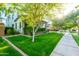Well-manicured lawn and lush greenery surround this inviting two-story home at 2973 E Austin Dr, Gilbert, AZ 85296