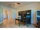 Bright home office with a ceiling fan, functional desk, and storage, perfect for remote work and productivity at 2973 E Austin Dr, Gilbert, AZ 85296