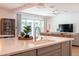 Open concept kitchen featuring a large island with seating and a view to the open living space at 2973 E Austin Dr, Gilbert, AZ 85296
