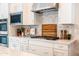 Gourmet kitchen features a gas range, marble backsplash, and stainless steel appliances for the home chef at 2973 E Austin Dr, Gilbert, AZ 85296