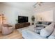 Comfortable living area with ample seating, a large TV, and stylish decor for relaxed living at 2973 E Austin Dr, Gilbert, AZ 85296