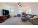 Spacious living area with comfortable seating, TV, and natural light from multiple windows at 2973 E Austin Dr, Gilbert, AZ 85296