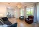 Bright living room with natural light, modern lighting fixture, and stylish furniture, a comfortable gathering space at 2973 E Austin Dr, Gilbert, AZ 85296