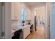 Bright home office features custom cabinets, desk space, and hardwood floors, perfect for remote work at 2973 E Austin Dr, Gilbert, AZ 85296