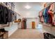 Spacious walk-in closet with carpet and with shelving for organizing clothes and accessories at 2973 E Austin Dr, Gilbert, AZ 85296
