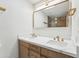 Modern bathroom with double sinks, quartz countertops, and sleek gold fixtures at 3026 E Bremen St, Phoenix, AZ 85032