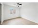 Comfortable bedroom with modern ceiling fan featuring bright natural light at 3026 E Bremen St, Phoenix, AZ 85032