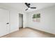 Bright bedroom features a ceiling fan, window, and closet at 3026 E Bremen St, Phoenix, AZ 85032