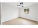 Minimalist bedroom with a window and a ceiling fan, ideal for relaxation and personalization at 3026 E Bremen St, Phoenix, AZ 85032