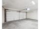 Spacious two-car garage with a white garage door and ample space for vehicles at 3026 E Bremen St, Phoenix, AZ 85032