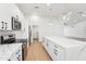 Bright kitchen features white cabinets, stainless steel appliances, and quartz countertops with a large center island at 3026 E Bremen St, Phoenix, AZ 85032