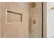 Luxurious shower featuring modern hardware, a built-in niche, and custom tilework at 3026 E Bremen St, Phoenix, AZ 85032