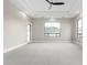 A bright bedroom with views of the local mountains, neutral paint, and ceiling fan at 3046 W Redwood Ln, Phoenix, AZ 85045