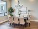 Formal dining area with elegant chandelier, comfortable seating, and large window at 3046 W Redwood Ln, Phoenix, AZ 85045