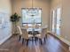 Cozy dining area with chandelier, modern decor, and natural light at 3046 W Redwood Ln, Phoenix, AZ 85045