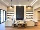Living room with fireplace, built-in shelves, modern lighting, and comfortable seating at 3046 W Redwood Ln, Phoenix, AZ 85045