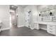 Spacious main bathroom features modern vanity, full mirror, and glass-enclosed shower with decorative tile at 3046 W Redwood Ln, Phoenix, AZ 85045