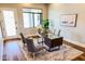 Bright home office with modern desk, comfortable chairs, and natural light at 3046 W Redwood Ln, Phoenix, AZ 85045