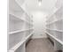 Walk-in pantry with ample shelving and tile flooring at 3046 W Redwood Ln, Phoenix, AZ 85045
