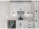 Wet bar with stainless steel wine cooler at 3046 W Redwood Ln, Phoenix, AZ 85045