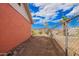 Backyard with a dirt area and chain link fence on the side at 3149 N 40Th Ln, Phoenix, AZ 85019