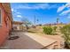 Backyard with a concrete walkway and dirt at 3149 N 40Th Ln, Phoenix, AZ 85019