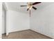 Bright and airy bedroom with a brick wall, neutral tiled flooring, and ceiling fan creating a versatile living space at 3149 N 40Th Ln, Phoenix, AZ 85019