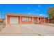 Cozy single-story home featuring an attached garage and gravel landscaping at 3149 N 40Th Ln, Phoenix, AZ 85019