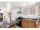 Bright kitchen showcasing white-painted brick and offering essential appliances for a functional cooking experience at 3149 N 40Th Ln, Phoenix, AZ 85019