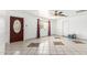 Bright living room with tile flooring, a ceiling fan, and an ornate front door at 3149 N 40Th Ln, Phoenix, AZ 85019