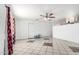 Open-concept living room with ample space, tile flooring, and natural light from the windows at 3149 N 40Th Ln, Phoenix, AZ 85019