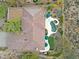 Aerial view of backyard oasis, highlighting the pool, spa, landscaping, and putting green at 33242 N 68Th Pl, Scottsdale, AZ 85266