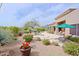 Expansive backyard with lush desert landscaping, a tranquil pool area, and comfortable outdoor seating for entertaining at 33242 N 68Th Pl, Scottsdale, AZ 85266