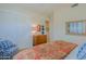 Serene bedroom boasts neutral walls, closet space, a comfy chair, and a charming dresser at 33242 N 68Th Pl, Scottsdale, AZ 85266
