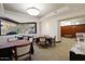 The dining area includes tables, chairs, and views through large windows at 33242 N 68Th Pl, Scottsdale, AZ 85266