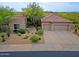 Stunning home boasts desert landscaping, a tile roof, and a spacious three-car garage at 33242 N 68Th Pl, Scottsdale, AZ 85266
