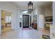 Welcoming foyer showcasing high ceilings, natural light, and stone flooring at 33242 N 68Th Pl, Scottsdale, AZ 85266