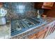 A close up of the stove, countertops, and cabinets at 33242 N 68Th Pl, Scottsdale, AZ 85266