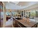Open concept kitchen with granite countertops, large island, and adjacent dining area at 33242 N 68Th Pl, Scottsdale, AZ 85266