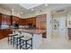 Modern kitchen with granite countertops, stainless appliances, and comfortable barstool seating at 33242 N 68Th Pl, Scottsdale, AZ 85266