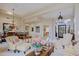 Open-concept space featuring a dining area, living room, and tiled walkway at 33242 N 68Th Pl, Scottsdale, AZ 85266