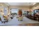 Bright living room featuring high ceilings, large windows, and elegant decor at 33242 N 68Th Pl, Scottsdale, AZ 85266