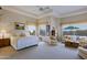Spacious main bedroom with sitting area and large windows at 33242 N 68Th Pl, Scottsdale, AZ 85266