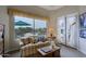 Cozy sitting area inside main bedroom with large window overlooking outdoors at 33242 N 68Th Pl, Scottsdale, AZ 85266