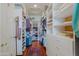 Organized walk-in closet featuring custom shelving, drawers, and ample storage space for clothes and accessories at 33242 N 68Th Pl, Scottsdale, AZ 85266
