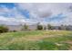 Large green backyard with a charming patio dining set, perfect for outdoor gatherings at 37185 N Falabella Dr, San Tan Valley, AZ 85140