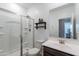 Bathroom with glass-enclosed shower, white vanity, and modern finishes at 37185 N Falabella Dr, San Tan Valley, AZ 85140