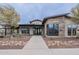 Elegant clubhouse exterior with stone accents and inviting entrance, perfect for community gatherings and events at 37185 N Falabella Dr, San Tan Valley, AZ 85140